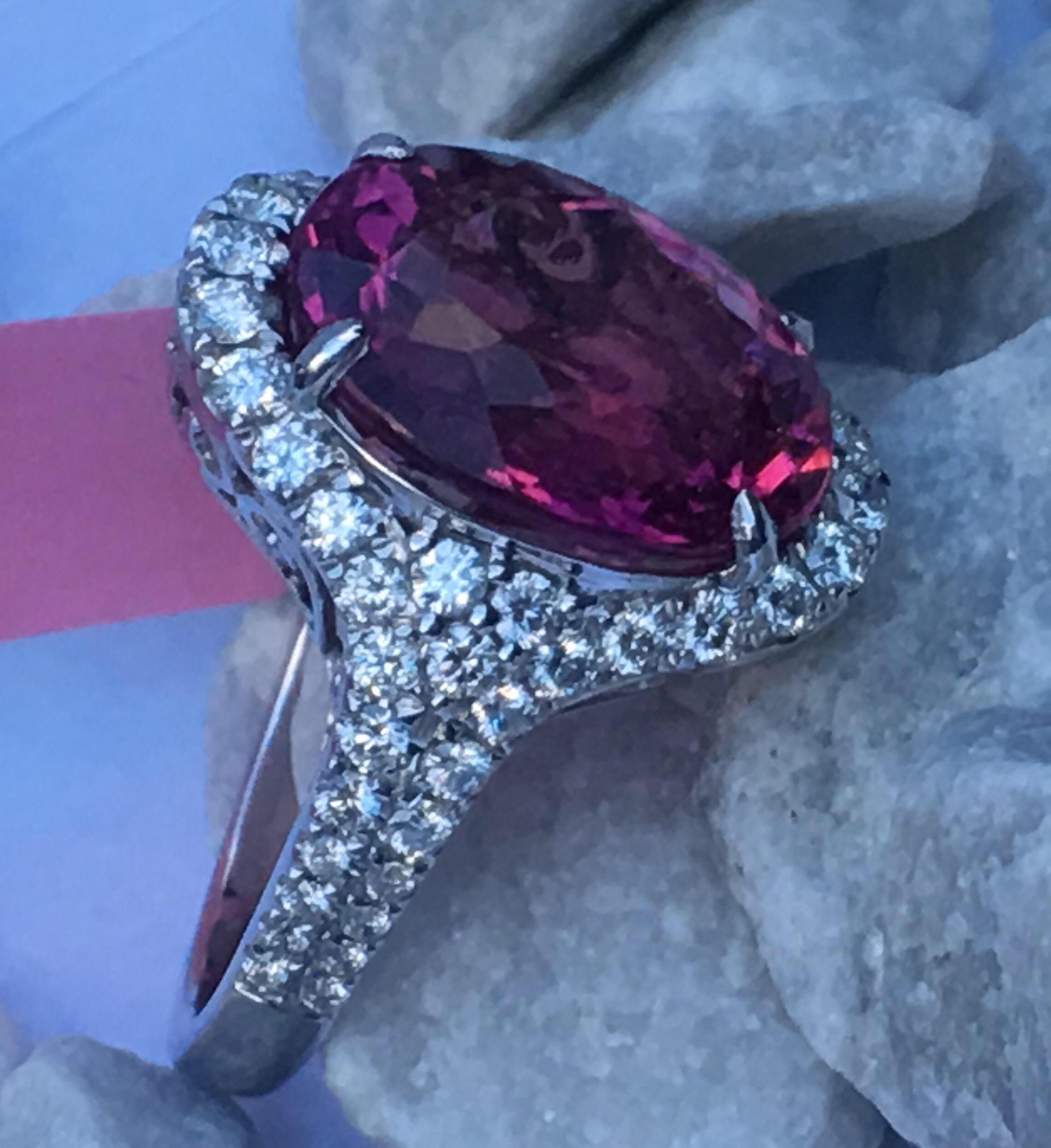 Natural Pink Tourmaline and Diamond Ring Set In 14K white Gold.
The Pink Tourmaline is 8.99 Carat. and Round White Diamonds SI1 Quality and E Color.
The size is 6.5 and can be resized if needed.