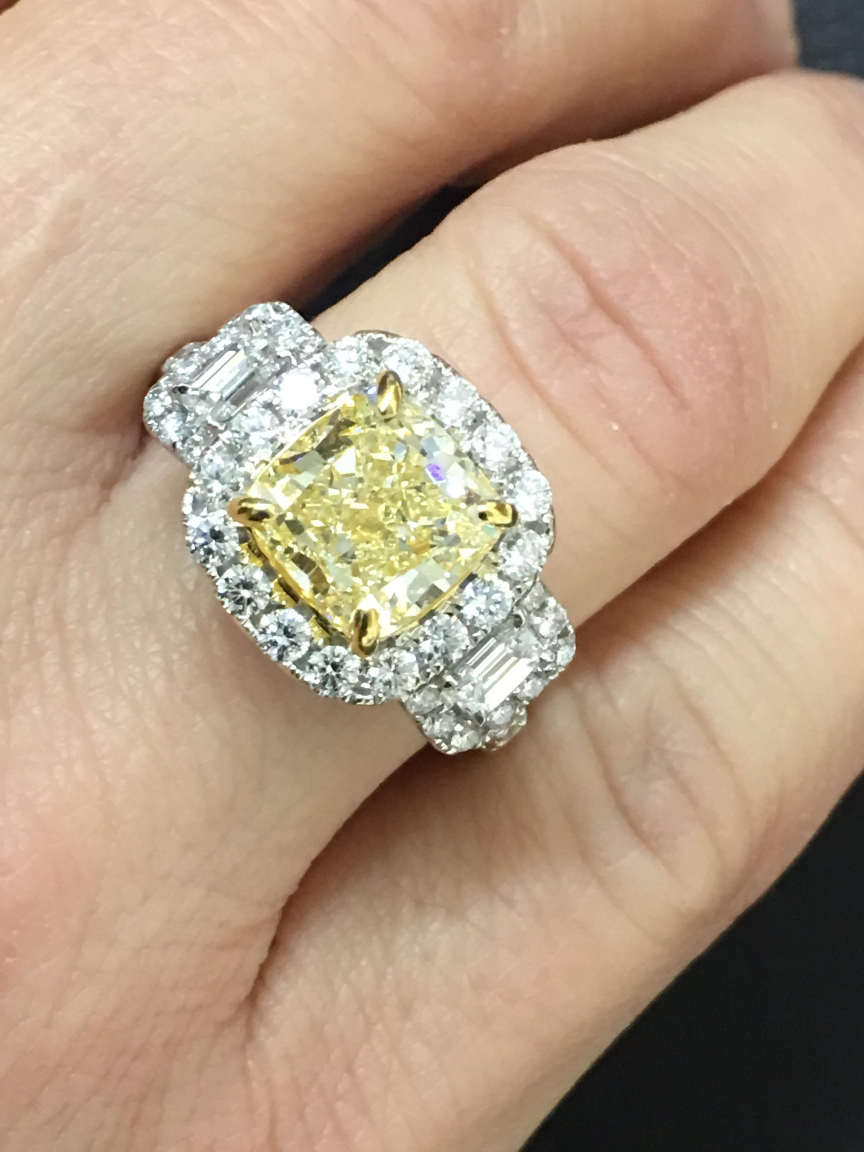Natural yellow Center Diamond  is three (3 ) Carat and other white diamond total weight  1.16 
Center Piece is IGL Certified 3 carat yellow Diamond the ring is  Set in 18 Karat Two Tone Gold.
This is one of a kind hand crafted ring.
Size if the ring