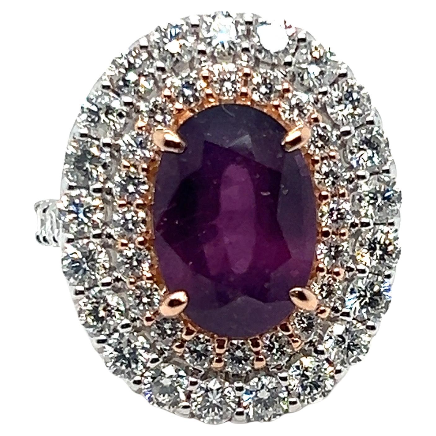 This exquisite ring features a GIA-certified 5.94-carat pink-purple sapphire, surrounded by a double-row diamond halo. The brilliant-cut diamonds are of exceptional quality, with a clarity of VS and color grade F. The sapphire is completely natural,