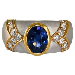 Anello con zaffiro e diamante in oro bicolore 16K