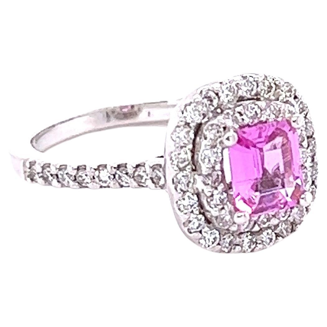 This beautiful ring has a Natural Emerald Cut Pink Sapphire that weighs 0.72 Carats and measures at approximately 6 mm x 5 mm. The Pink Sapphire is GIA Certified and does show indications of heating as per industry standards. The GIA Certificate
