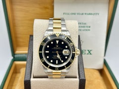 Rolex Submariner Date Black 16613 40mm 18k Yellow Gold Stainless Steel Box Paper