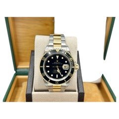 Rolex Submariner Date Black 16613 40mm 18k Yellow Gold Stainless Steel Box Paper
