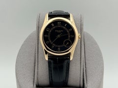 Patek Philippe Calatrava 5000J, 33 mm, schwarzes Zifferblatt, 18 Karat Gelbgold, neues Armband, Begleitheft