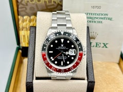 Rolex GMT Master 16700, 40 mm, „Coke“-Lünette in Rot und Schwarz, Edelstahl, mit Originalpapieren