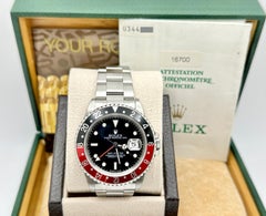 Rolex GMT Master 16700, 40 mm, „Coke“-Lünette in Rot und Schwarz, Edelstahl, mit Originalpapieren