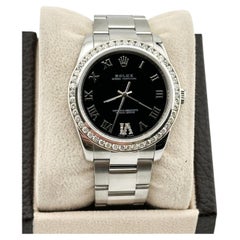 Rolex Oyster Perpetual 114200 34mm Black Roman Dial Diamond Bezel Steel