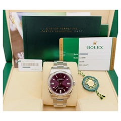 Rolex Oyster Perpetual 116000, 36 mm, quadrante rosso uva, acciaio inossidabile, scatola e documenti