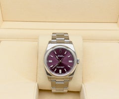 Rolex Oyster Perpetual 116000, 36 mm, quadrante rosso uva, acciaio inossidabile, scatola e documenti