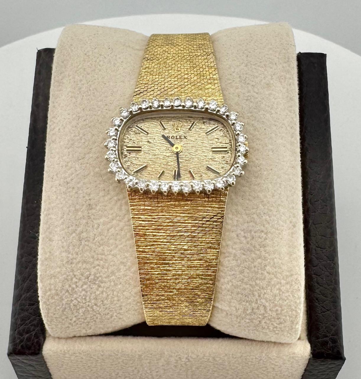 Style Number: 8365

Year: Est. 1937 

Model: Rolex Vintage Ladies Cocktail Watch

Case Material: 14K Yellow Gold

Band: 14K Yellow Gold

Bezel: Diamond Bezel

Dial: Gold

Case Size: 19mm x 24mm

Gold Weight: 44.2g

Includes: 
-Elegant Watch