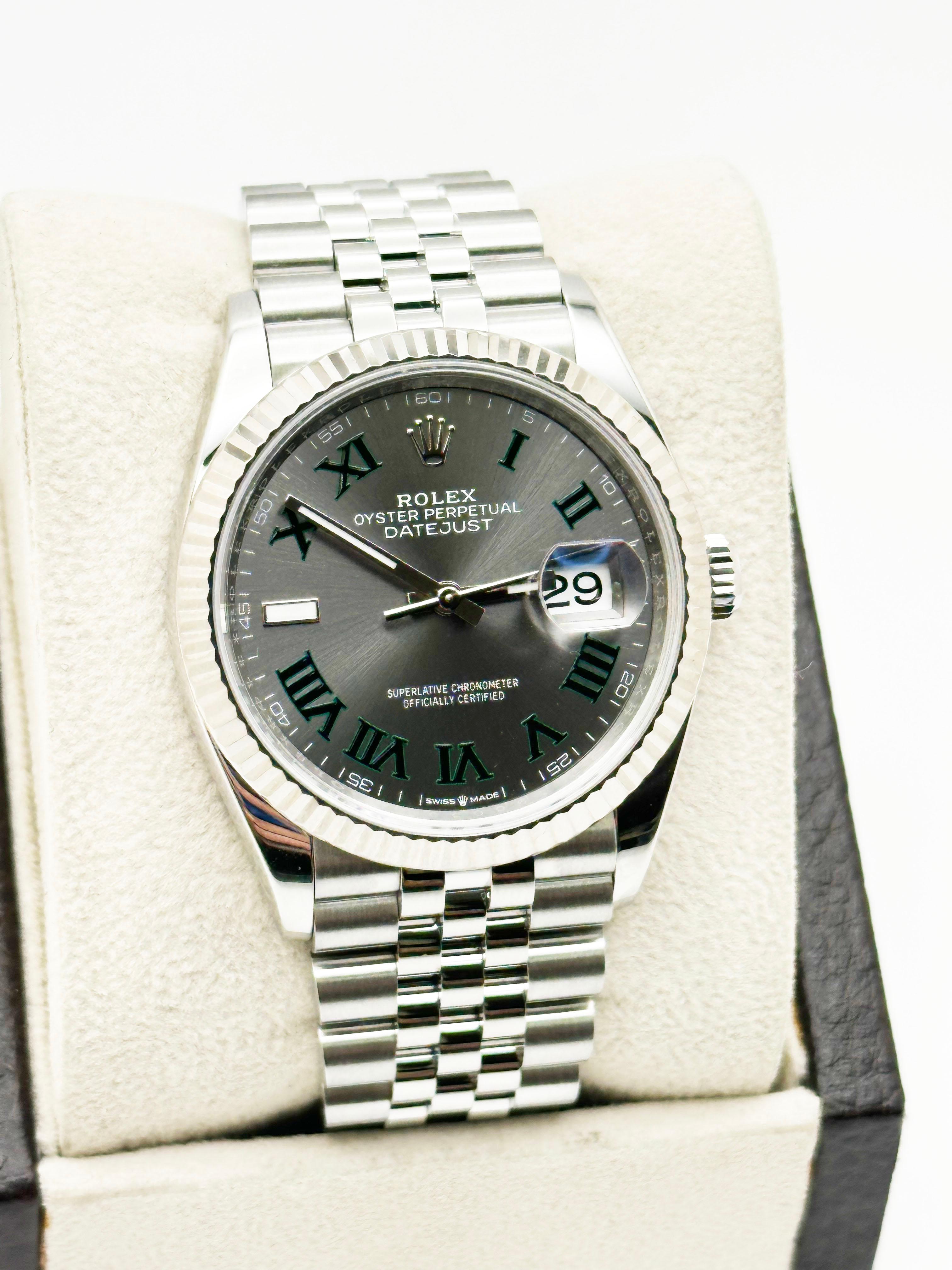 Style Number: 126234

Serial: 39003***

Year: 2024
 
Model: Rolex Datejust
 
Case Material: Stainless Steel
 
Band: Stainless Steel Jubilee Band
  
Bezel: 18K White Gold Fluted Bezel 
  
Dial: Wimbledon Dial 
 
Face: Sapphire Crystal 
 
Case Size: