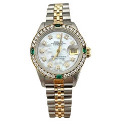 Rolex Ladies Datejust 69173 White MOP Diamond Dial Emerald Bezel Steel 18K Gold
