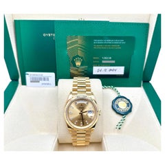 Rolex President Day-Date 36 128238 2024, cadran champagne serti de diamants taille baguette, or 18 carats