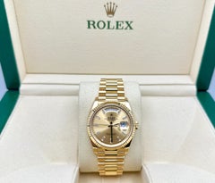 Rolex President Day-Date 36 128238 2024, cadran champagne serti de diamants taille baguette, or 18 carats