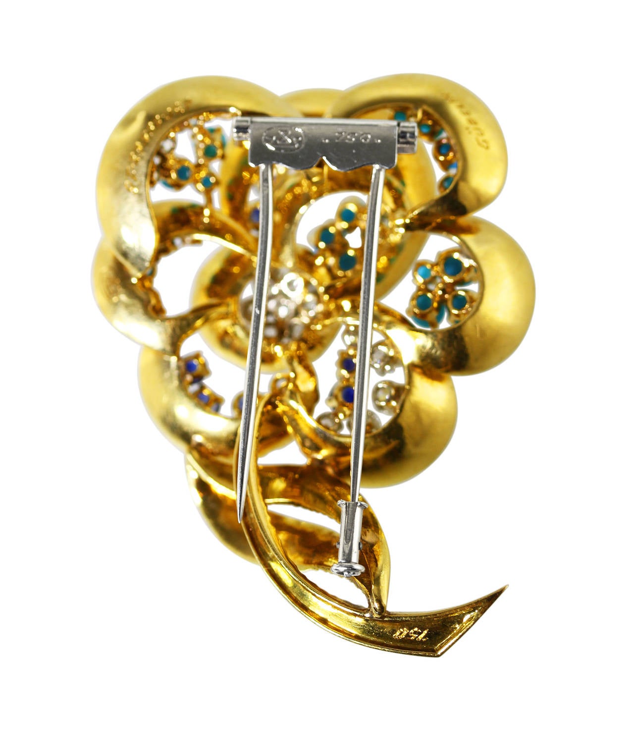 An 18 karat yellow gold, turquoise, sapphire and diamond flower brooch by Gubelin, the stylized flower set with 20 turquoise cabochons, 10 round sapphires weighing approximately 2.00 carats, and 16 round diamonds weighing approximately 1.60 carats,