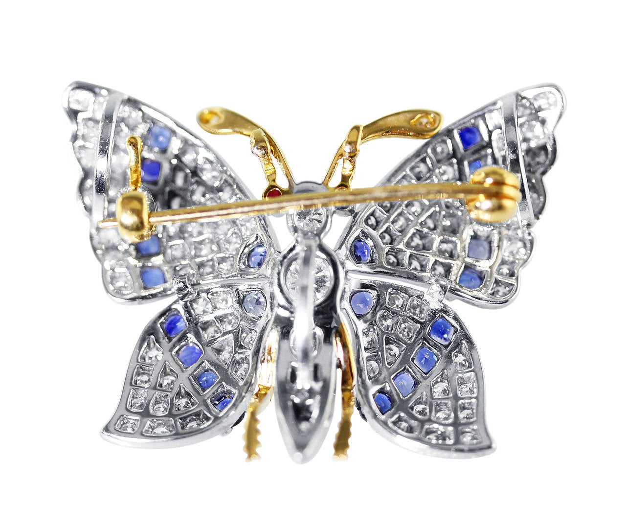 A whimsical 18 karat yellow gold, platinum, sapphire and diamond butterfly brooch, designed as a butterfly with wings extended set throughout with 101 round diamonds weighing approximately 1.50 carats, and 22 round blue sapphires weighing