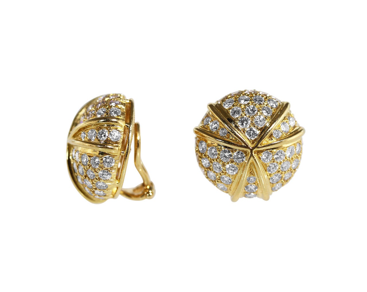 A pair of 18 karat gold and diamond earclips by Harry Winston, the circular clips of bombe form set with 114 round diamonds weighing approximately 4.50 carats, accented by polished gold crossing tendrils, gross weight 18.1 grams, measuring 3/4 by