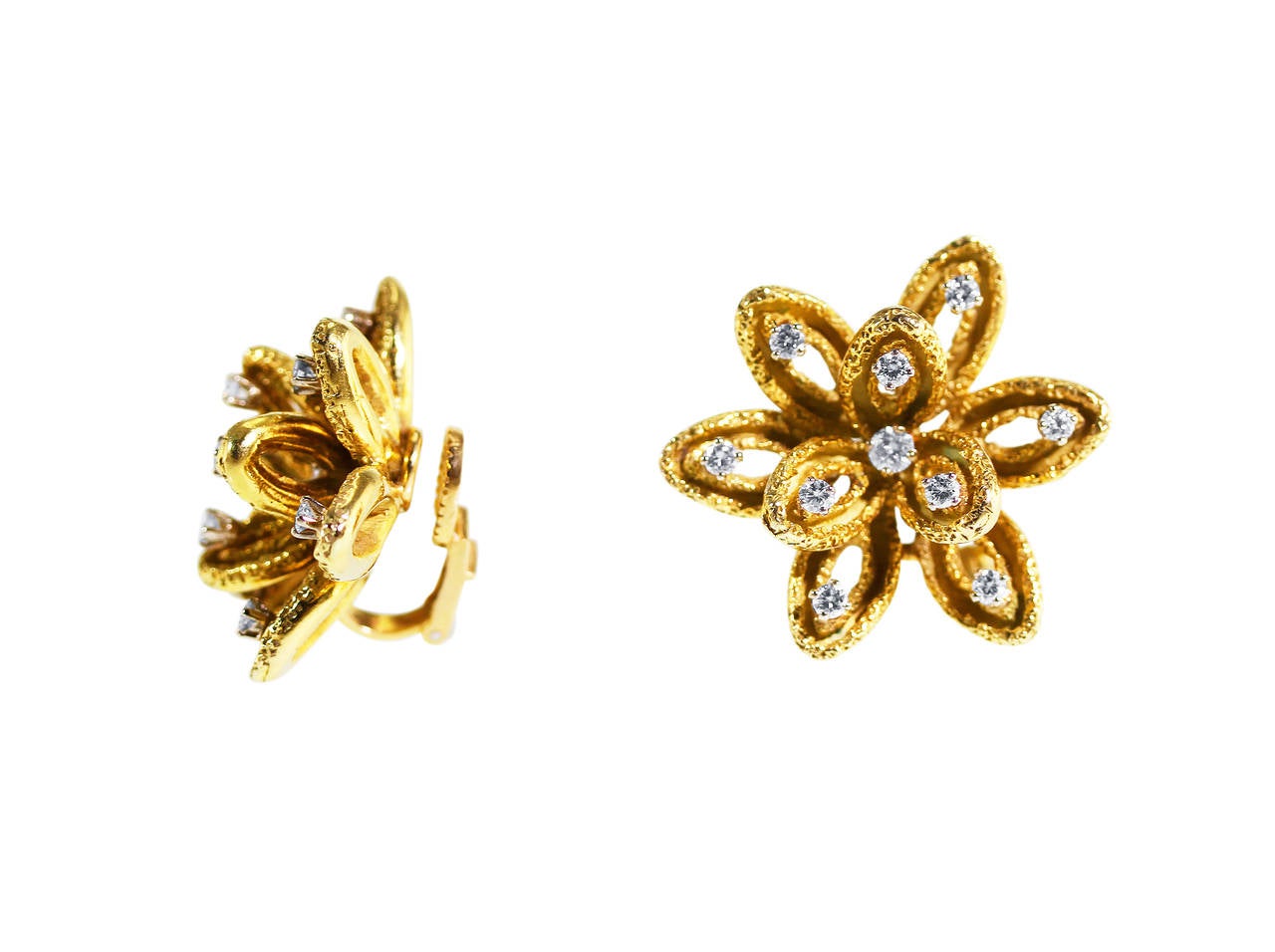 A pair of 18 karat yellow gold and diamond flower earclips by Boucheron, Paris, designed as stylized flowers of texutred gold design set with 20 round diamonds weighing approximately 1.10 carats, gross weight 25.7 grams, measuring 1 1/8 by 1 1/8