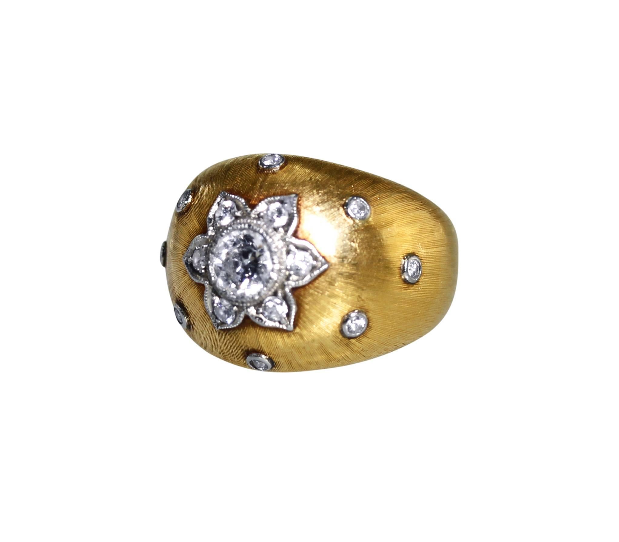 An 18 karat white and yellow gold and diamond ring by Buccellati, circa 1940, of bombe design set in the center with a round diamond weighing approximately 0.50 carat, accented by 14 round diamonds weighing approximately 0.20 carat, measuring 5/8 by