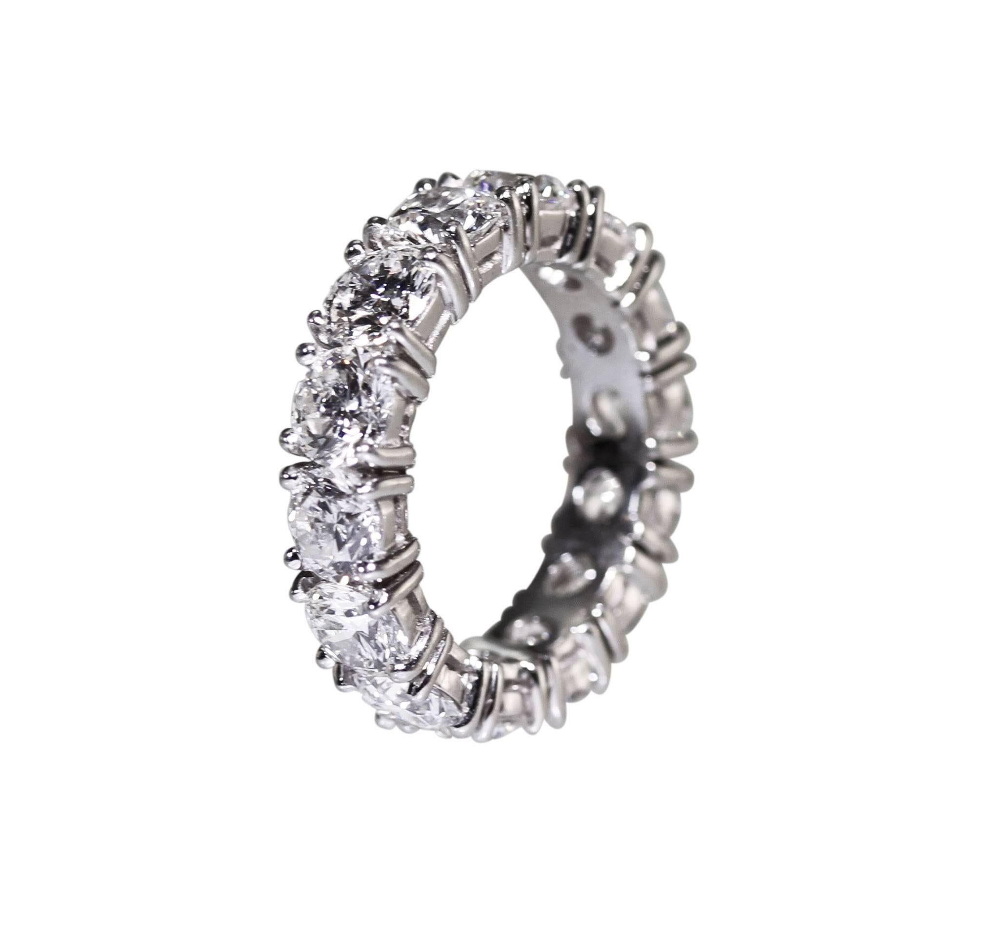 A platinum and diamond eternity ring by Graff, set with 14 round diamonds weighing 7.44 carats, measuring 1/4 by 1 by 1 inch, gross weight 10.2 grams, finger size 6, signed Graff, numbered 16757.
Accompanied by Graff Replacement Value for Insurance