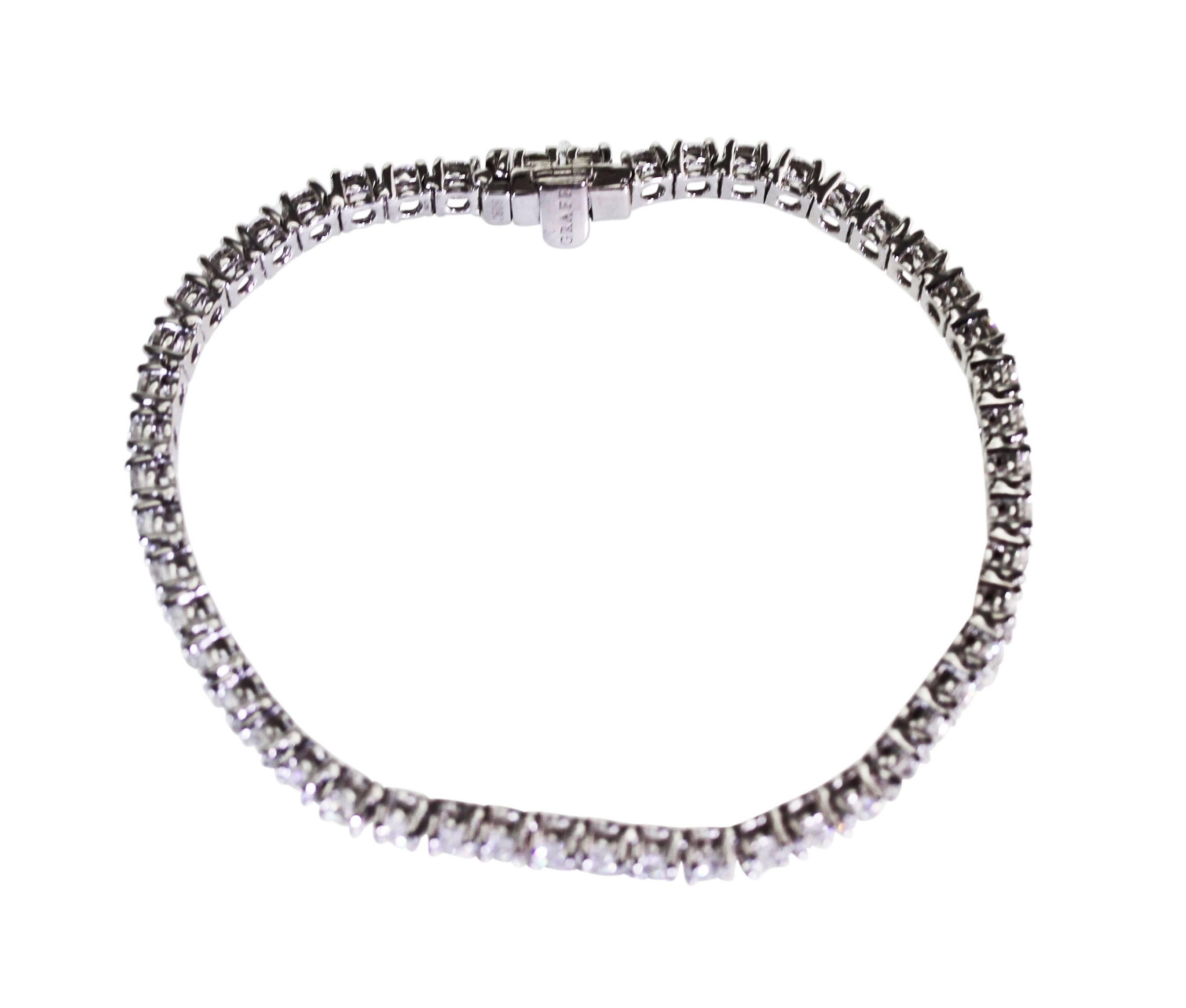 An 18 karat white gold and diamond straight-line bracelet by Graff, set with 53 round diamonds weighing 8.42 carats, measuring 7 1/4 inches, gross weight 16.1 grams, signed Graff, numbered 5280, stamped AU.
Accompanied by Graff  Replacement