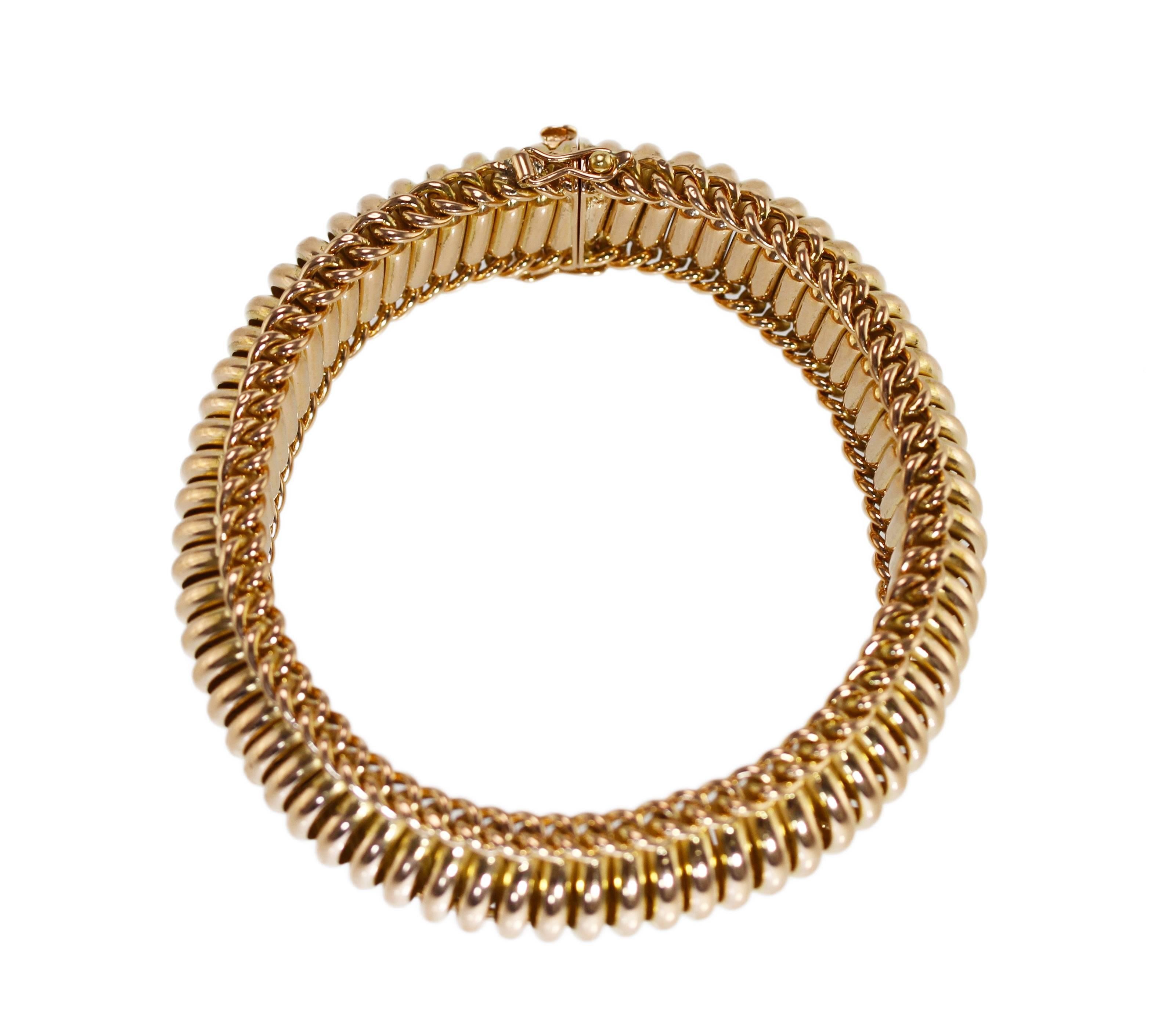 An 18 karat gold bracelet, France, designed as multiple hollow-link tubes perpendicularly lining the bracelet, length 7 1/2 inches, width 3/4 inch, gross weight 38.7 grams, with French assay marks.