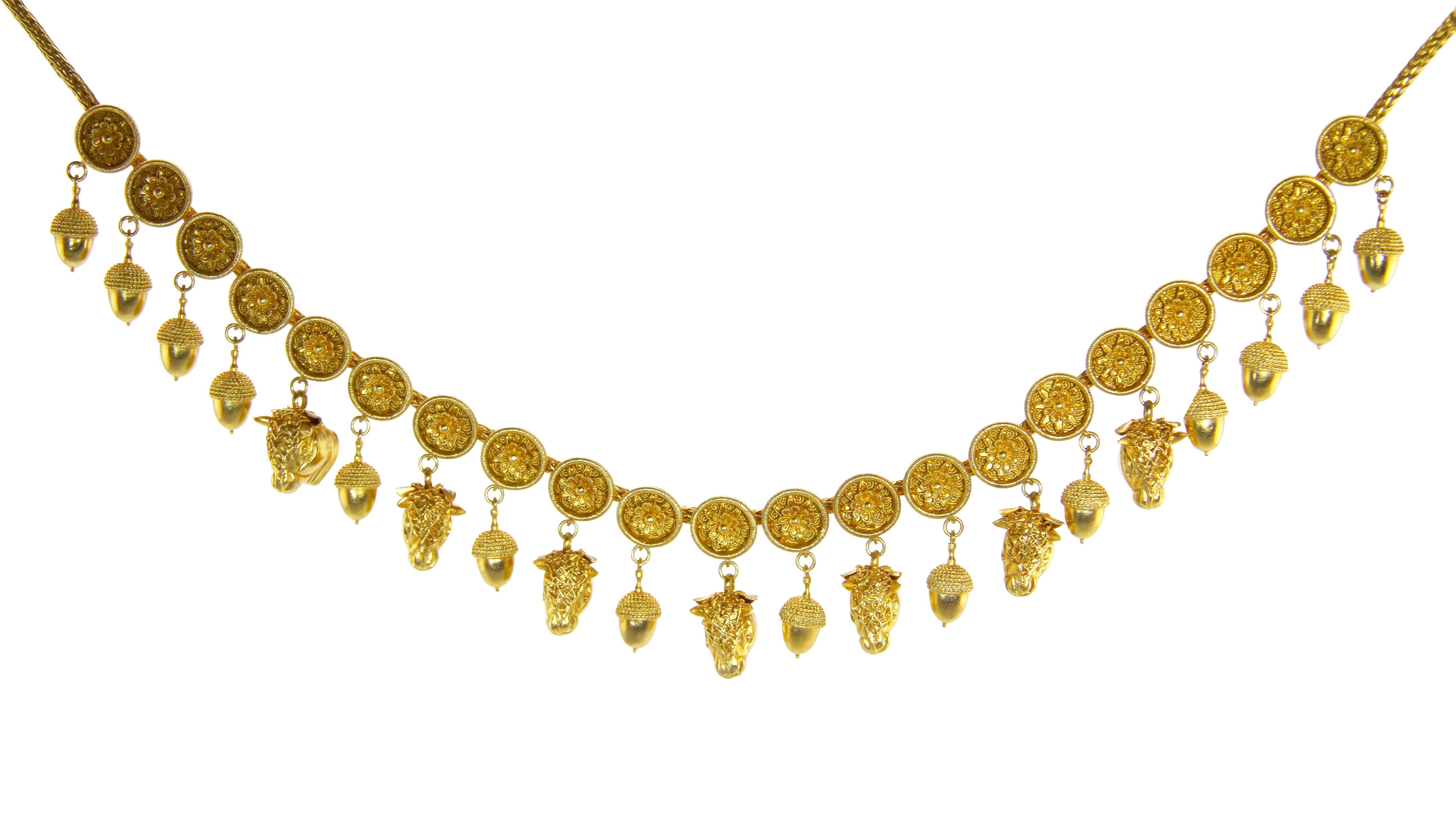 An 18 karat gold necklace by Lalaounis, Greece, designed as an alternating fringe of bullheads and acorns suspended from 21 circular floral medallions, completed by a rounded foxtail chain, length 16 inches, gross weight 89.8 grams, with maker's