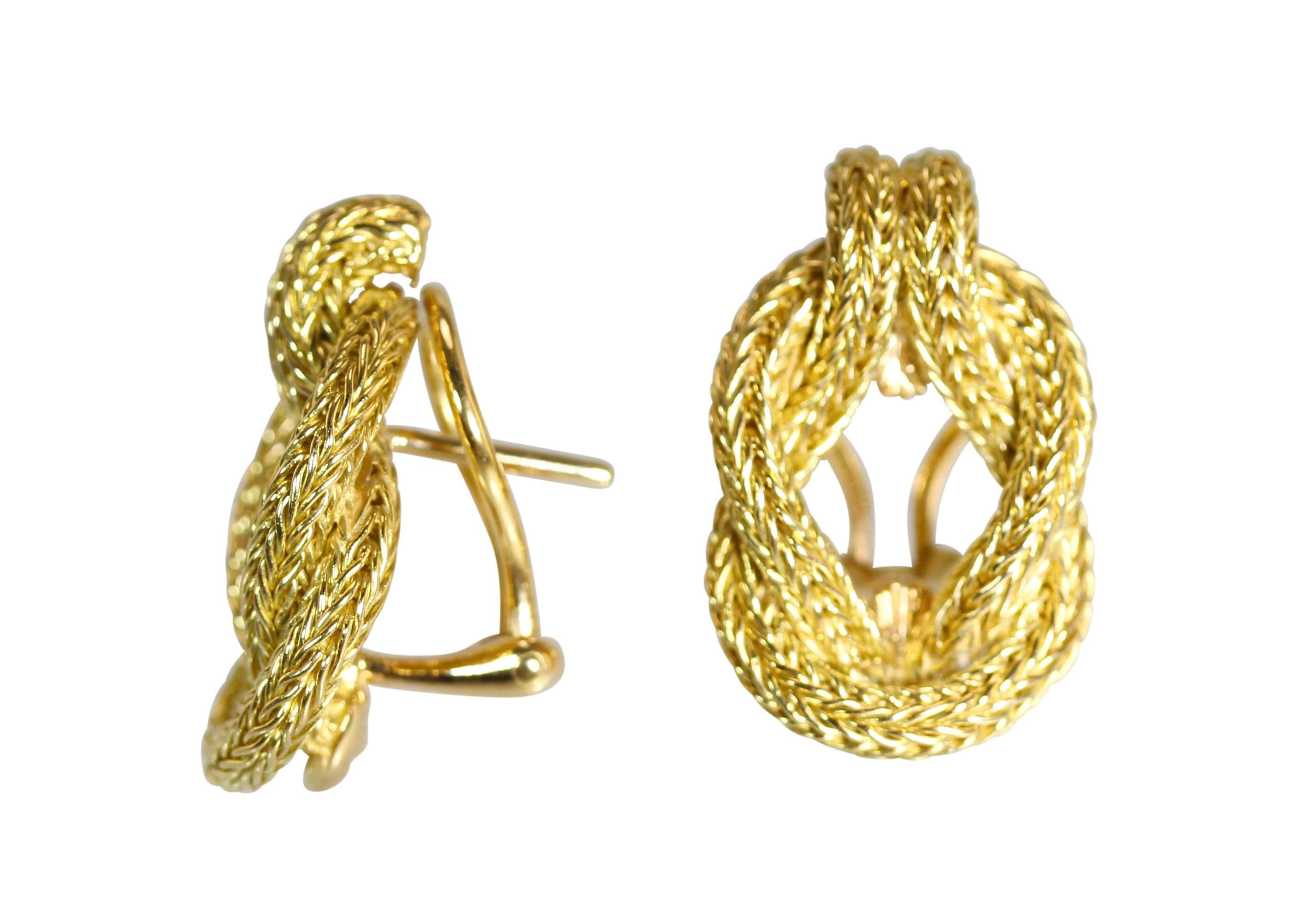 A pair of 18 karat gold earclips by Lalaounis, Greece, designed as the Hercules knots of gold rope, measuring 1 by 5/8 inch, gross weight 17.5 grams, stamped 750, GR A21, with makers mark for Lalaounis.