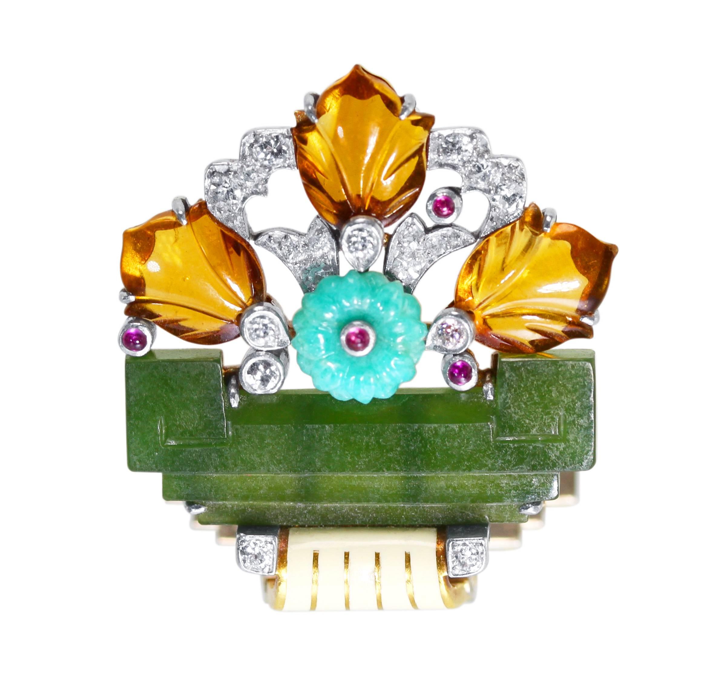 Art Deco 18 karat yellow gold, platinum, diamond, ruby, citrine, nephrite, amazonite and enamel clip brooch by Cartier
• Signed Cartier
• 10 single-cut and 8 old European-cut diamonds approximately 0.50 carat
• Carved Nephrite, citrine and