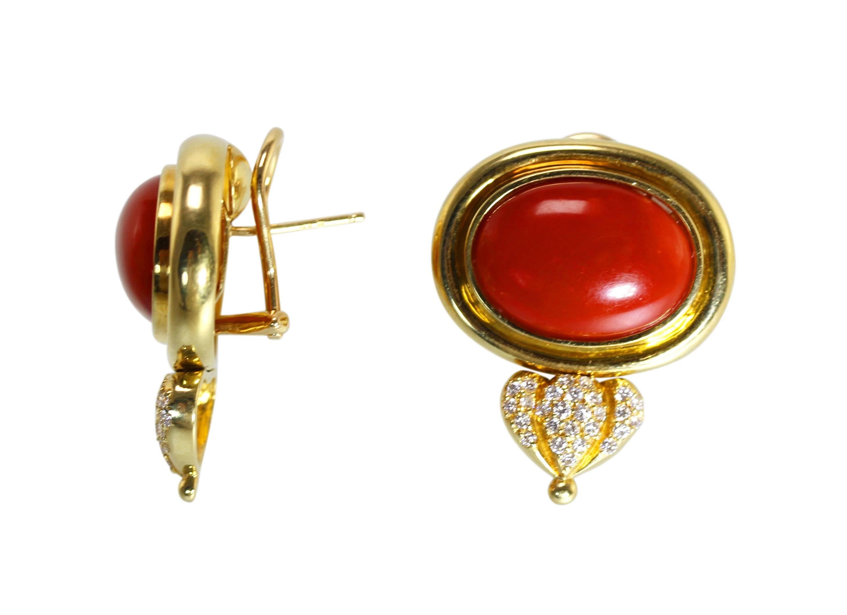 Pair of 18 Karat Gold, Coral and Diamond Earclips
• Stamped 18k
• Two elongated cabochon coral each measuring approximately 18.0 by 13.0 by 8.0 mm
• 52 round diamonds approximately 0.75 carat
• Measuring 1 by 1 1/8 inches, gross weight 25.3 grams