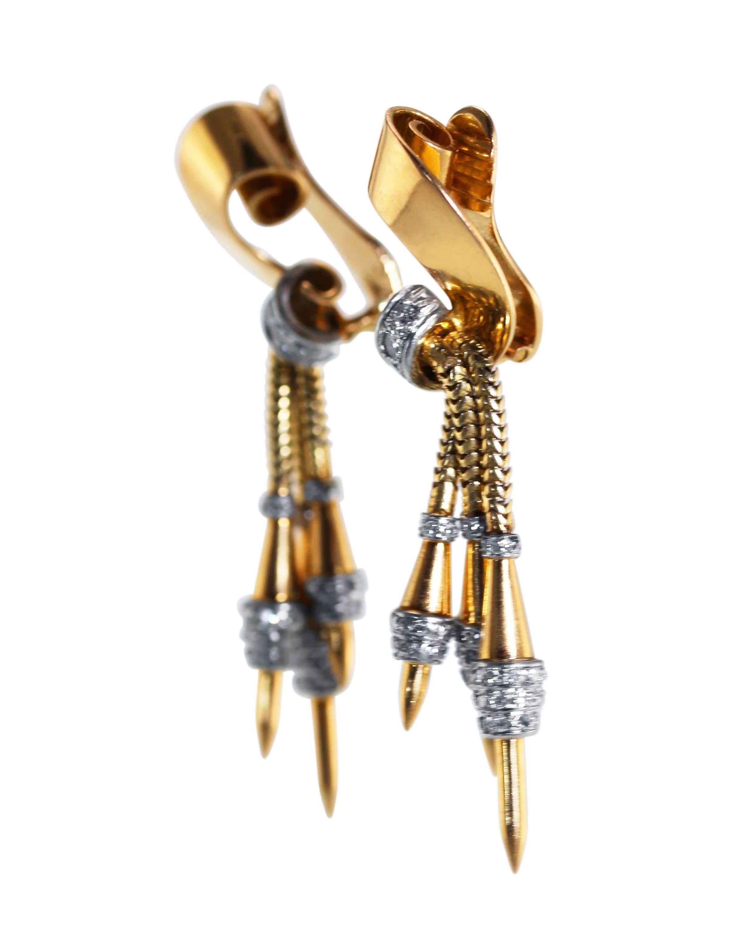Pair of Retro 18 Karat Gold, Platinum and Diamond Earclips
• 176 round diamonds weighing approximately 1.25 carats
• Measuring 2 1/8 by 1/2 inches, gross weight 19.6 grams