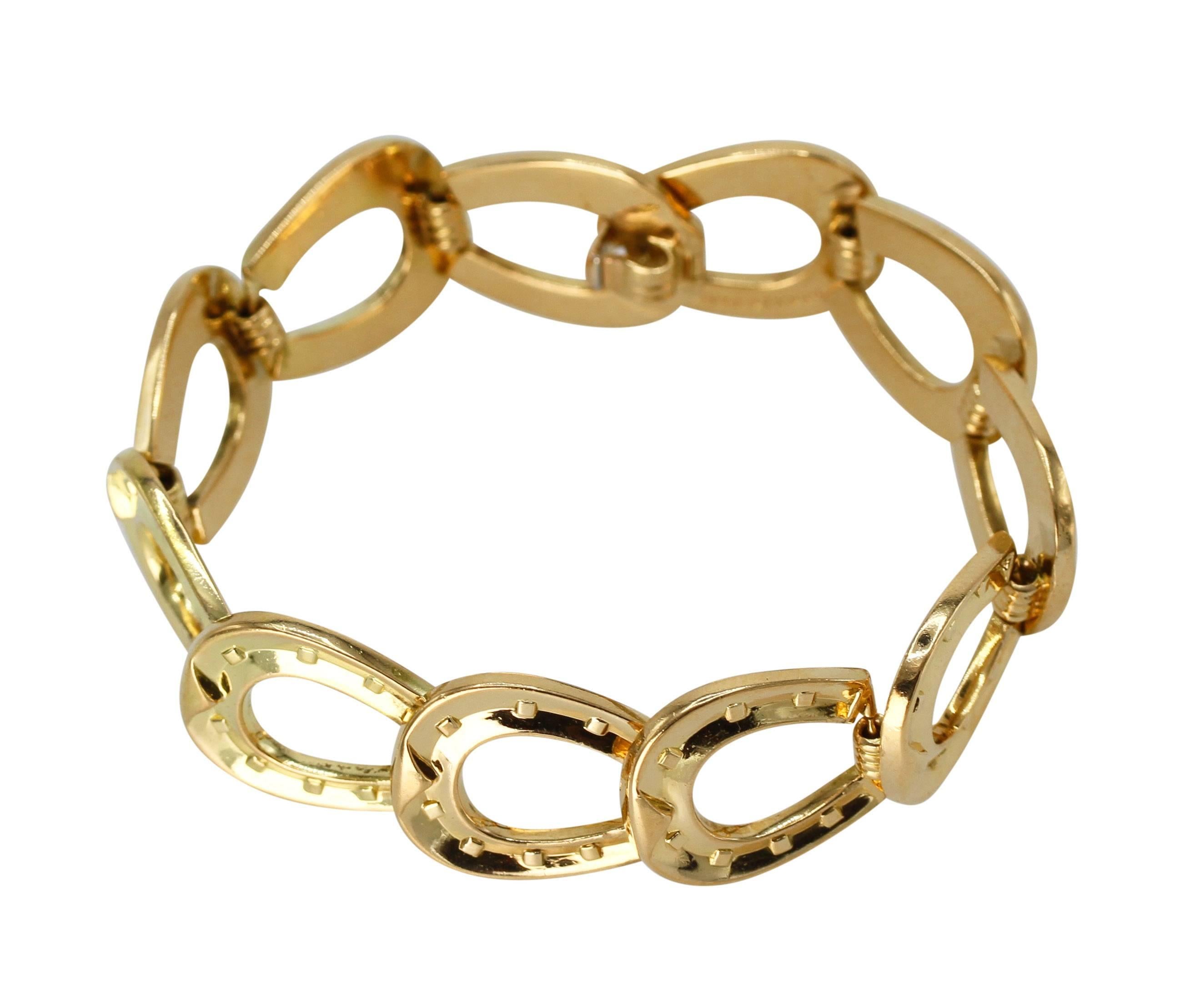 An 18 karat yellow gold horseshoe link bracelet by Hermès, Paris, designed as a series of polished gold horseshoe shaped links, gross weight 54.0 grams, length 7 1/4 inches, width 5/8 inch, signed Hermès, Paris.