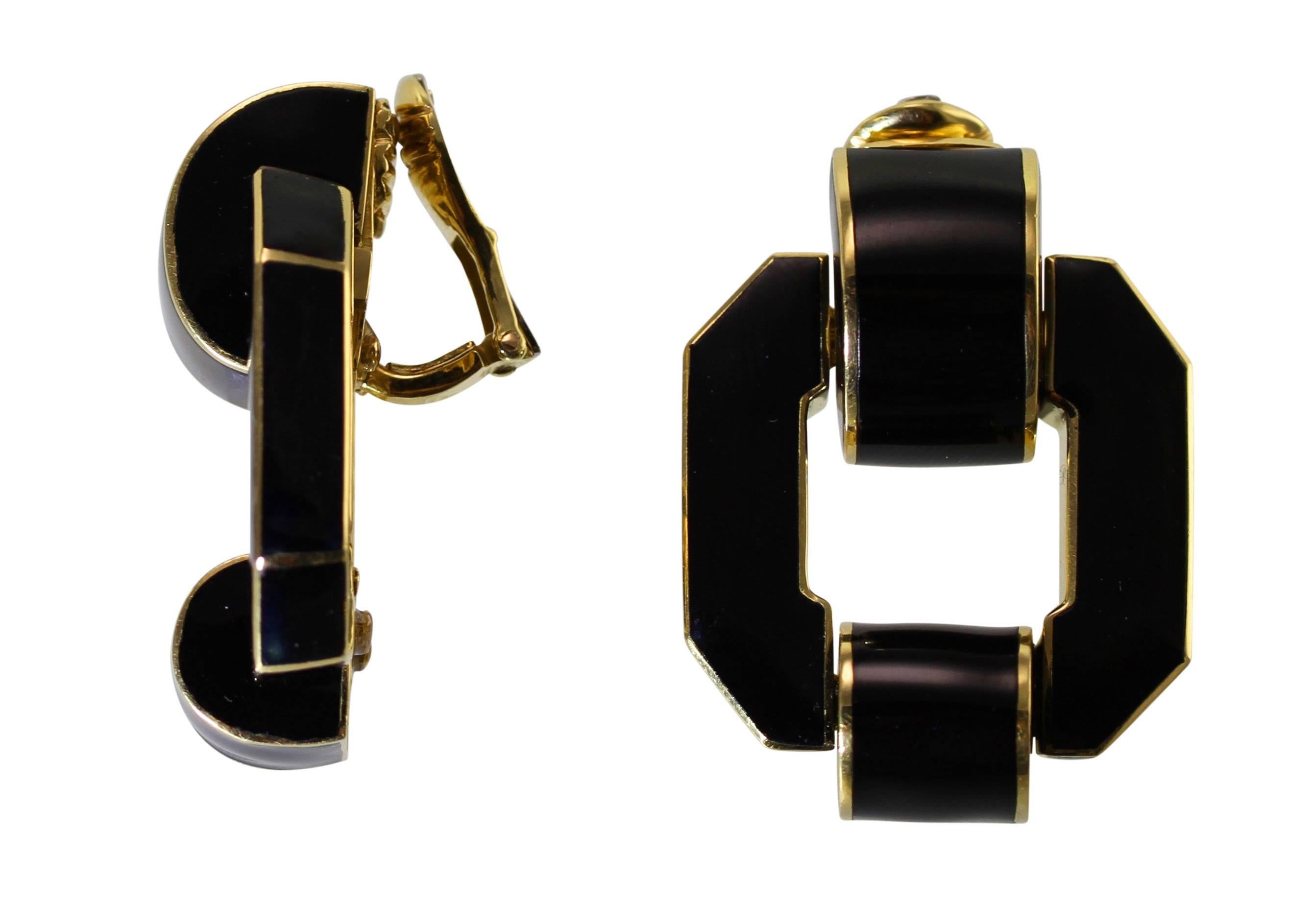 A pair of 18 karat yellow gold and black enamel earclips by David Webb, designed as geometric door-knockers applied with black enamel, measuring 1 1/2 by 1 1/8 inches, gross weight 63.2 grams, signed David Webb, numbered BS79, stamped 18k.