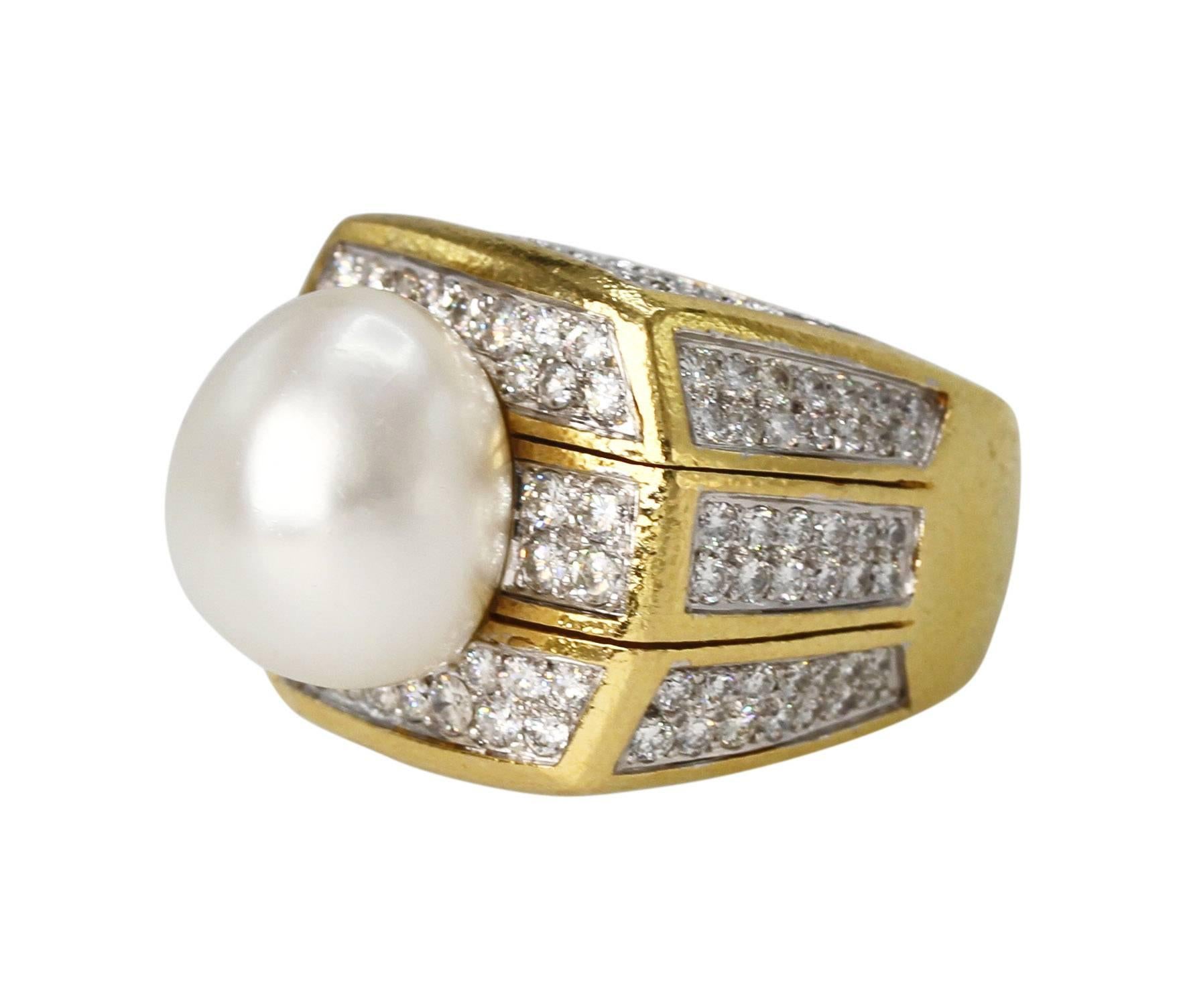 18 Karat Yellow Gold, Baroque Cultured Pearl and Diamond Ring by David Webb
• Signed David Webb, 18K/Plat
• Baroque Pearl measuring approximately 16.0 mm.
• 168 round diamonds weighing approximately 5.00 carats
• 18 karat yellow gold, gross weight