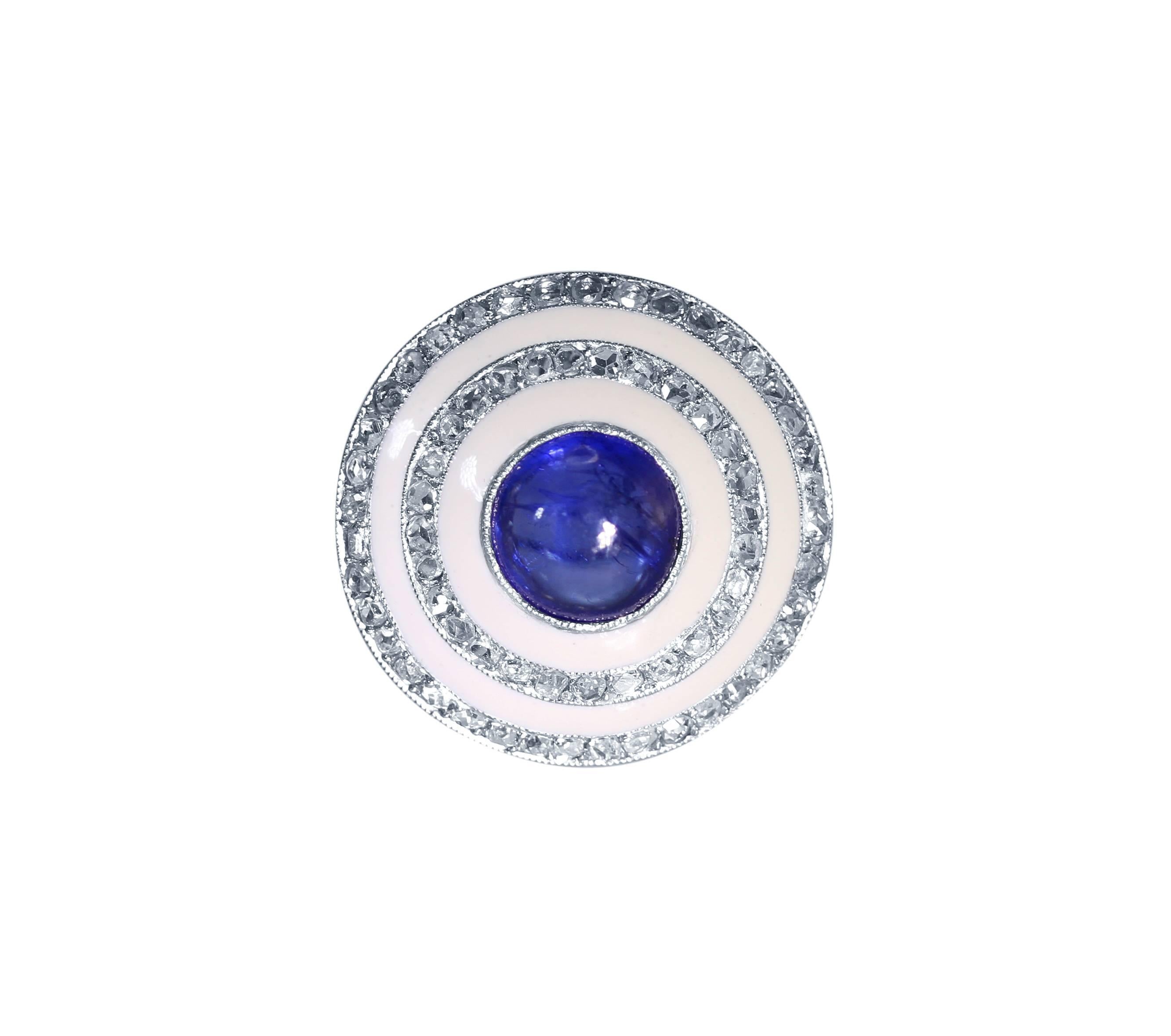 Edwardian Platinum, Sapphire, Diamond and White Enamel Ring
• Center bezel-set with a round cabochon sapphire approximately 4.00 carats
• 80 rose cut diamonds weighing approximately 1.20 carats
• Size 8 1/2, gross weight of 9.7 grams, measuring 7/8