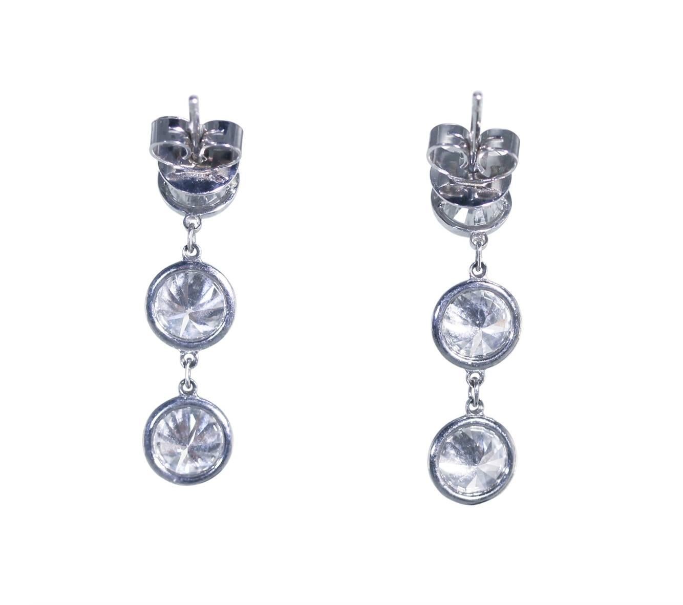 Pair of Handmade Platinum and Diamond Earrings
• 6 round diamonds collet-set, approximately 4.00 carats
• G-H color, VS2-SI1 clarity, well cut
• Platinum
• Length 1 inch, 3.5 grams gross weight