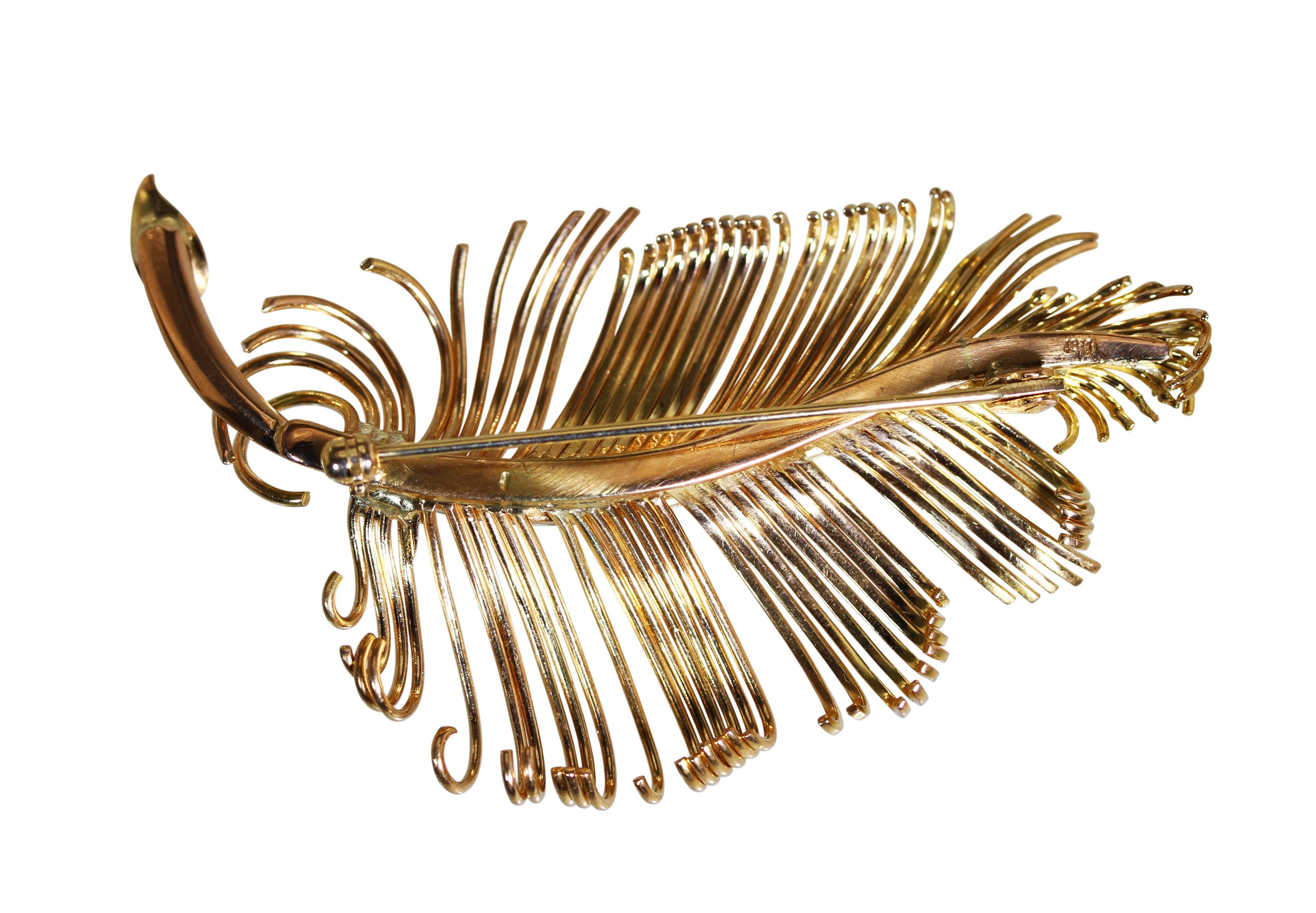 18 Karat Rose Gold and Diamond Feather Brooch
• Stamped 18k
• 10 single-cut diamonds approximately 0.20 carat
• Measuring 2 1/2 by 1 1/2 inch, gross weight 18.1 grams