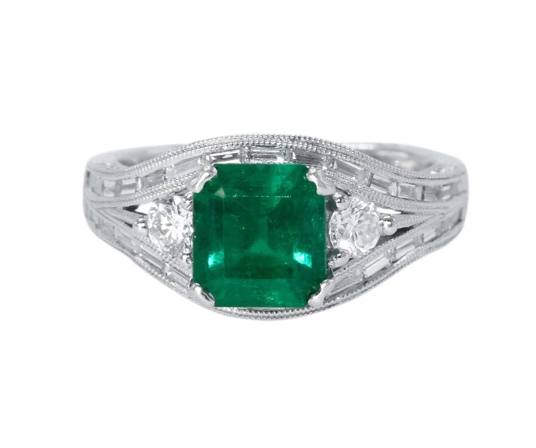 18 Karat White Gold, Emerald and Diamond Ring
• Emerald-cut emerald weighing approximately 1.60 carats
• 74 round and 30 baguette diamonds approximately 1.20 carats
• Stamped 18K 750
• Size 5 1/2, gross weight 7.0 grams