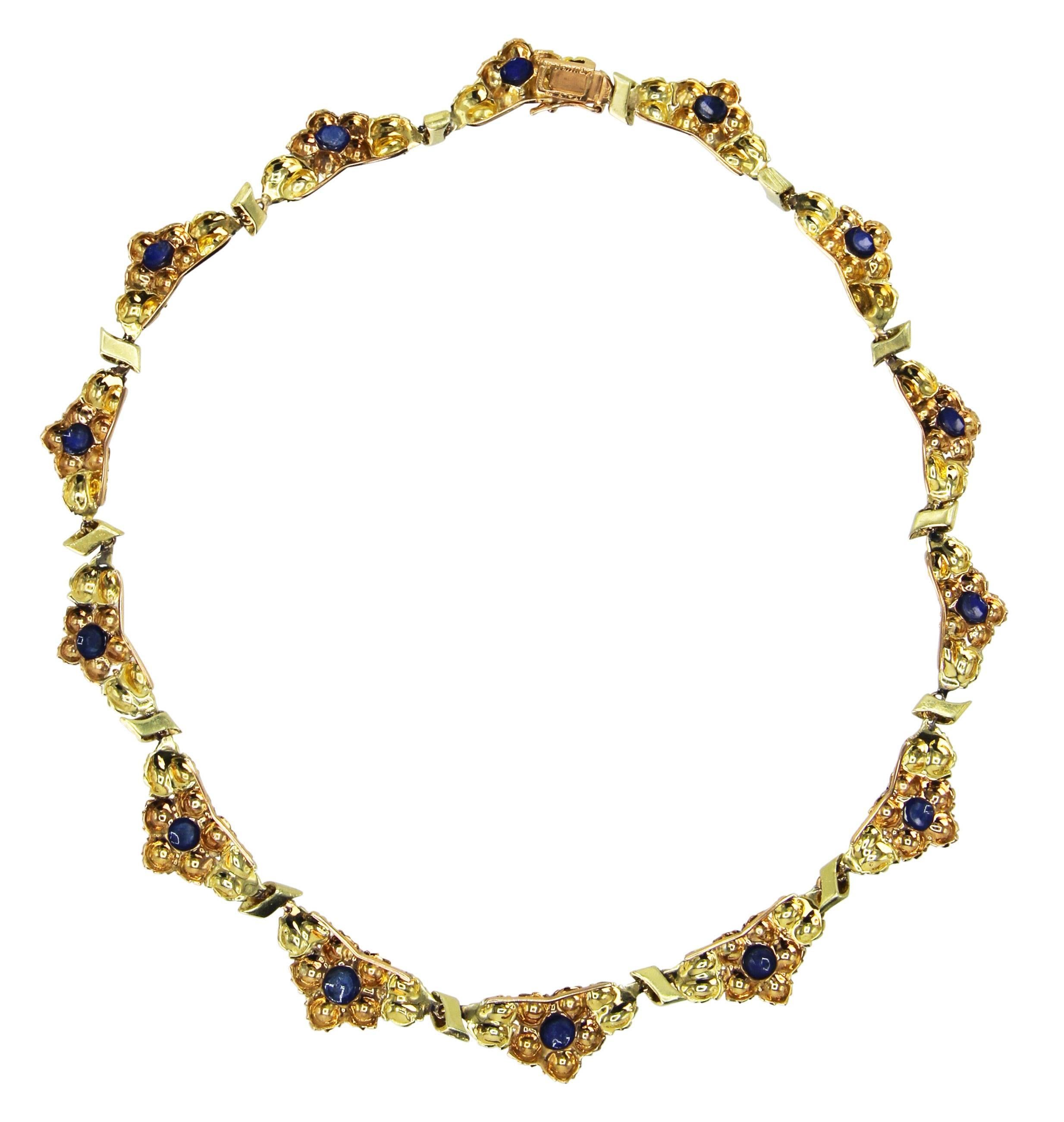 18 Karat Two-Tone Gold and Sapphire Necklace by Buccellati, Italy, circa 1960
• Signed M. Buccellati, Italy
• 14 cabochon sapphires approximately 7.50 carats
• Gross weight 34.0 grams, length 15 1/4 inches, width 5/8 inch