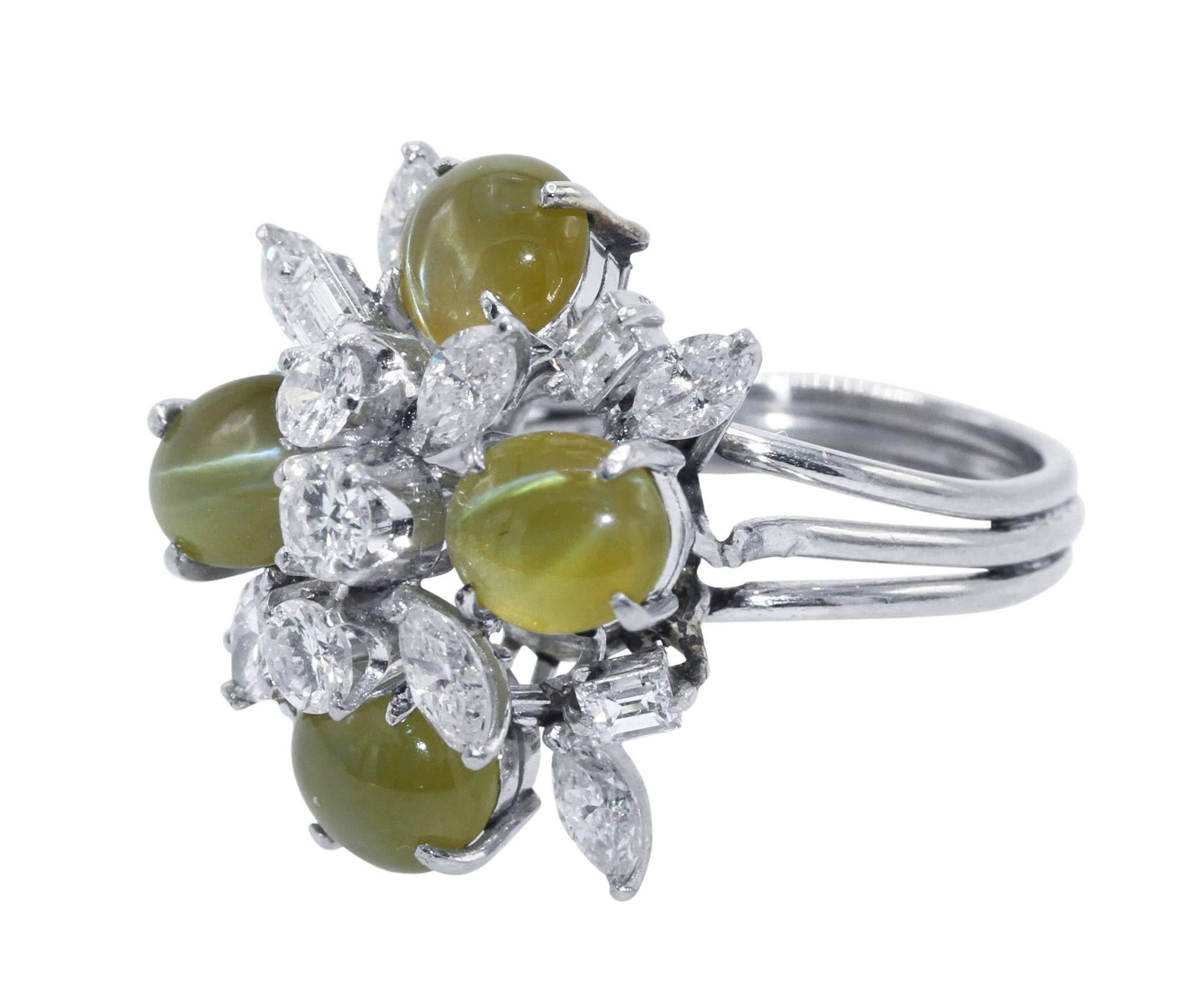 Platinum, Cat's-Eye Chrysoberyl and Diamond Ring
• Stamped PLAT with indistinct maker's mark
• 4 cabochon cat's-eye chrysoberyls weighing approximately 10.00 carats
• 3 round diamonds approximately 0.50 carat, 4 baguette diamonds approximately 0.50