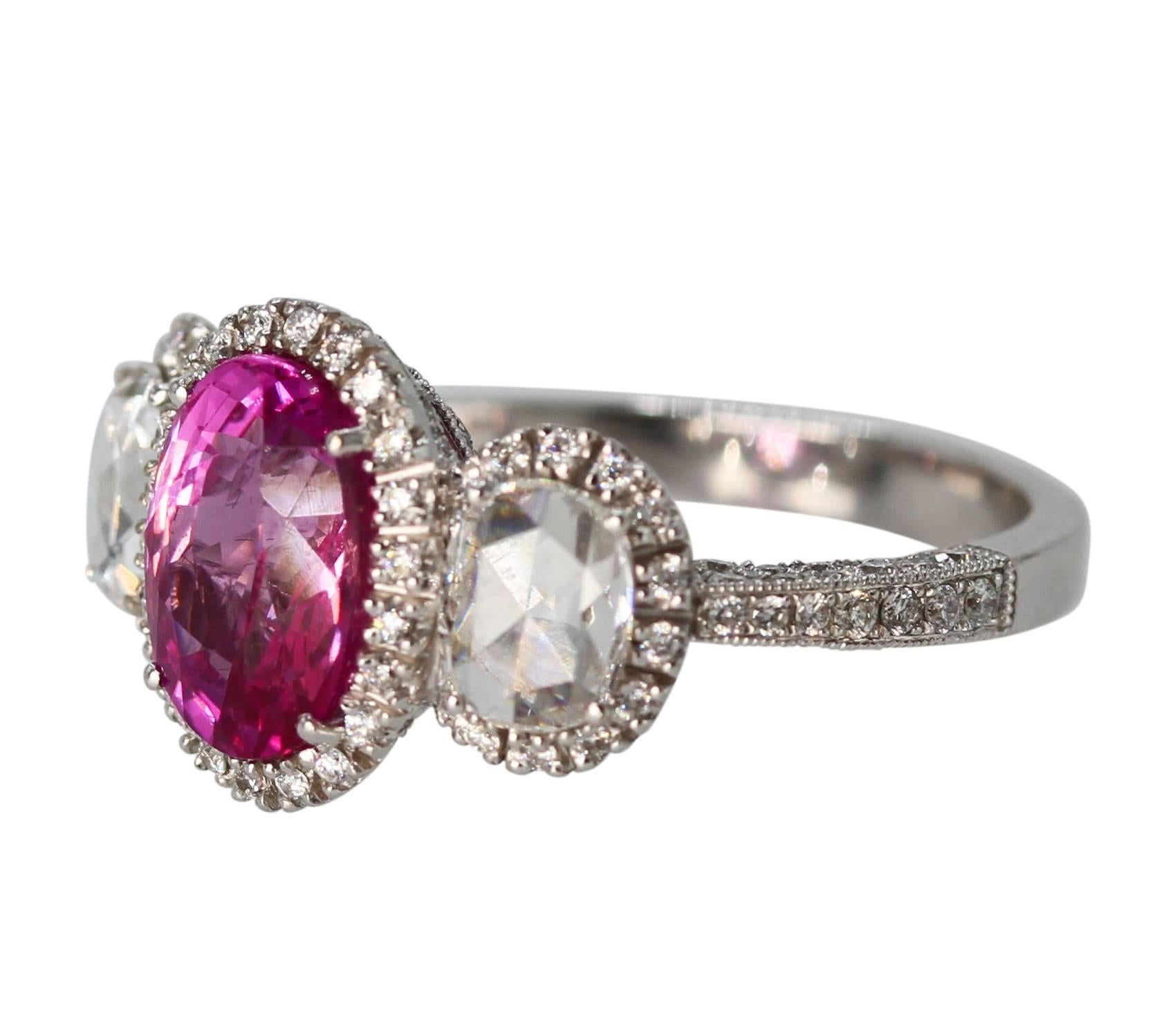 18 Karat White Gold, Pink Sapphire and Diamond Ring
• Oval pink sapphire weighing approximately 2.50 carats
• 2 rose-cut diamonds weighing approximately 0.70 carat
• 180 round diamonds weighing approximately 1.80 carats
• Gross weight 6.7