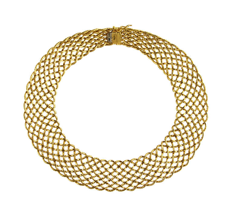 A beautifully made 18 karat yellow gold 'Crèpe de Chine' necklace by Buccellati, of graduated design composed of numerous interlocking ropetwist links, gross weight 134.0 grams, length 15 1/2 inches, width at front 1 1/8 inches, signed Buccellati,