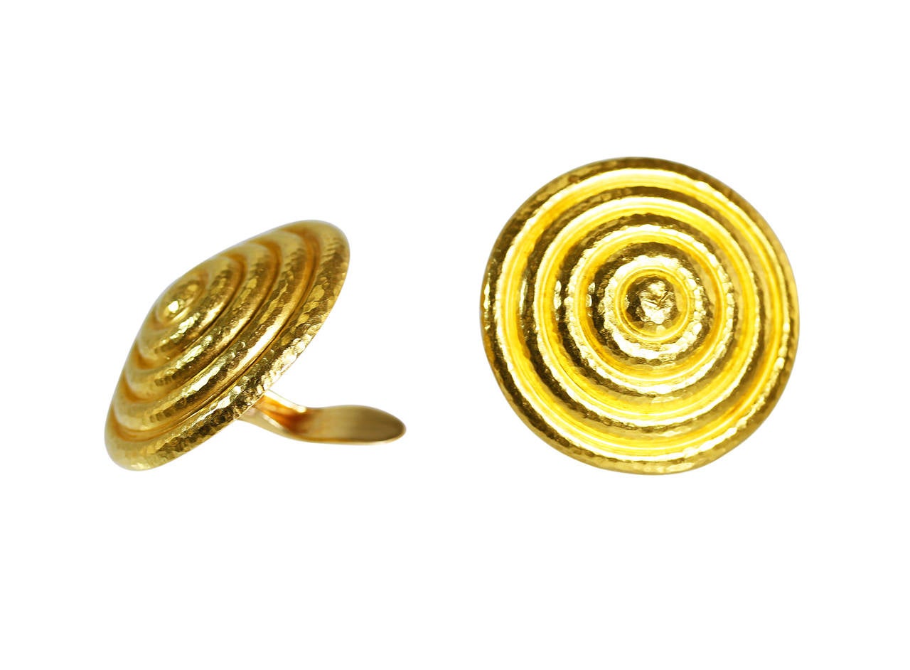 A pair of 18 karat yellow gold disc earclips by Lalaounis, Greece, designed as large discs of bombe form, gross weight 30.0 grams, measuring 1 3/8 by 1 3/8 inches, signed Lalaounis, with maker's mark for Lalaounis, numbered 21.  Highly sculptural,