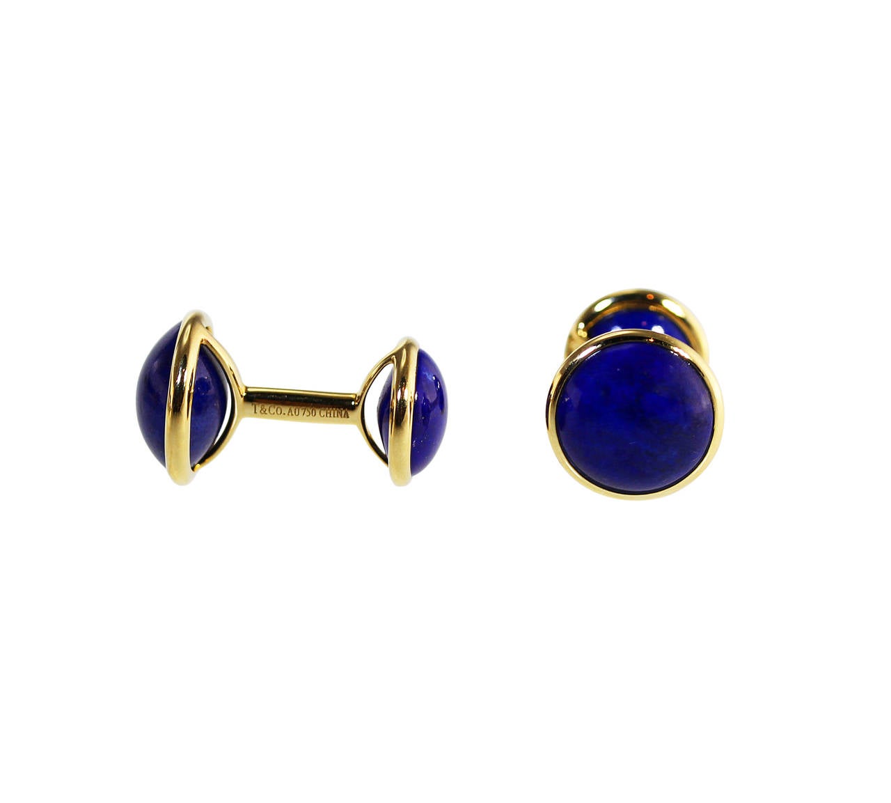 A pair of 18 karat yellow gold and lapis lazuli cufflinks by Elsa Peretti for Tiffany & Co., the terminals set with 4 cabochon lapis lazuli, gross weight 9.4 grams, measuring 1 by 1/2 inch, signed Elsa Peretti and T & Co., stamped AU 750 China, with