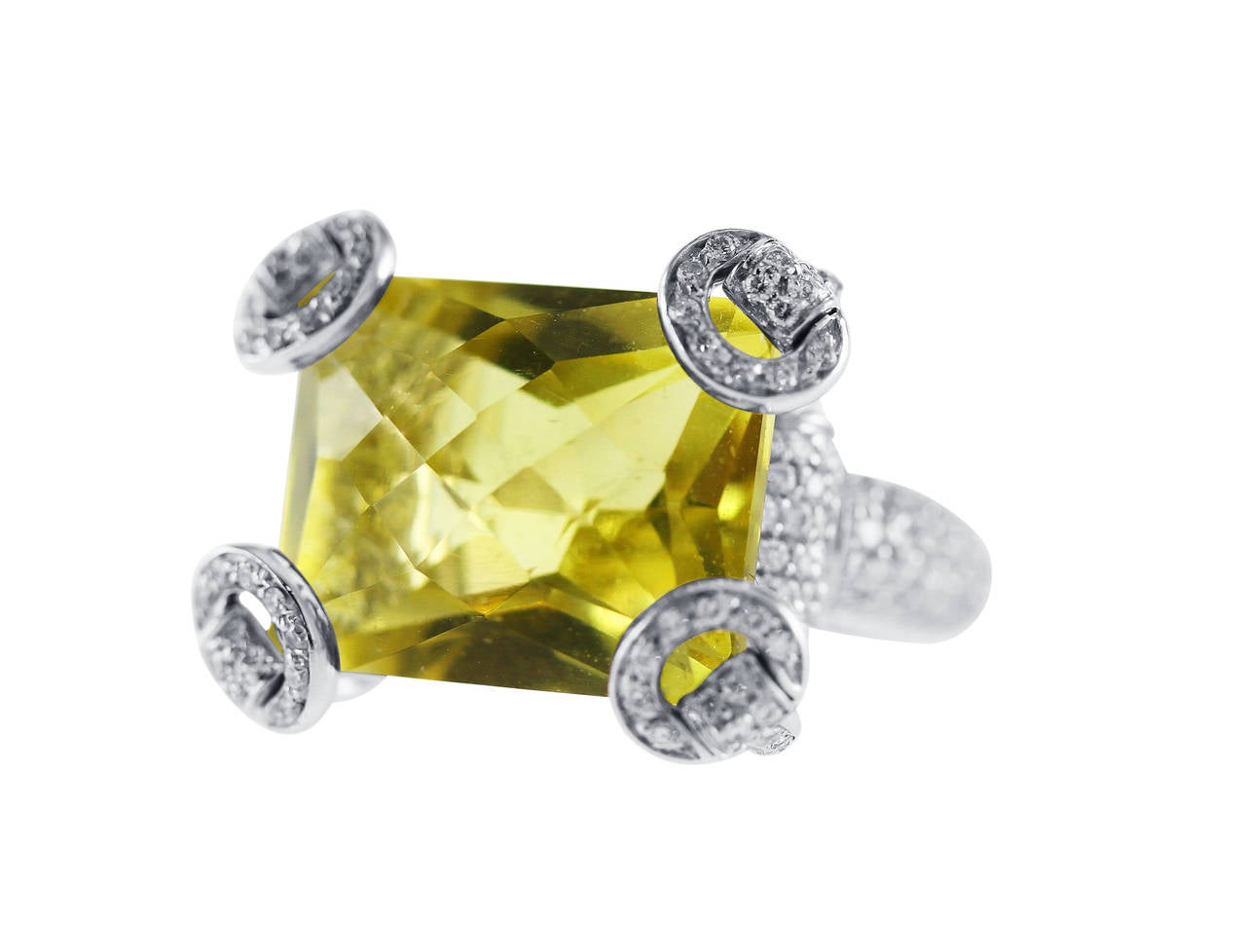 An 18 karat white gold, lemon citrine and diamond 'Horsebit' ring by Gucci, set in the center with a mixed-cut lemon citrine weighing approximately 12.00 carats, with stylized 'horsebit' prongs set throughout with 195 round diamonds weighing