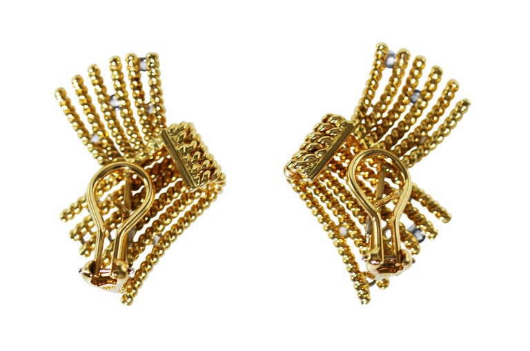 A pair of 18 karat yellow gold, platinum and diamond V-Rope Earclips by Schlumberger for Tiffany & Co., designed as ropetwist tendrils in a V formation accented by 20 round diamonds weighing approximately 1.40 carats, gross weight 20.5 grams,