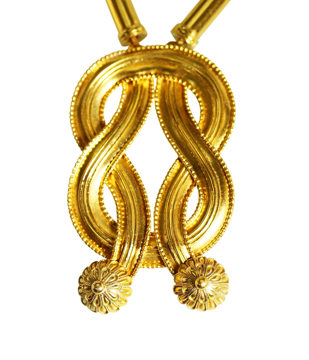 A 22 karat yellow gold pendant necklace by Lalaounis, designed as a long chain of barrel links completed by a Herculean knot at the center, gross weight 105.6 grams, length 24 inches, drop measuring 2 1/4 inches, with maker's mark.