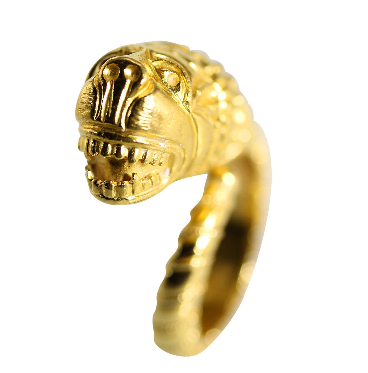 An 18 karat gold lion's head ring by Lalaounis, Greece, designed as a lion's head with body wrapping around, all of textured gold, gross weight 9.6 grams, size 5 3/4, measuring 1 1/2 by 1 by 1/2 inches, with maker's mark for Lalaounis, numbered A.8,