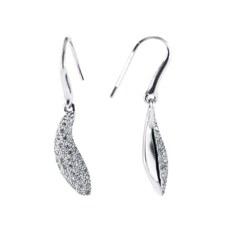 A pair of 18k white gold diamond pave pendant-earrings by Frank Gehry for Tiffany & Co., of curved drop design pave-set with 104 round diamonds weighing approximately 1.50 carats, gross weight 9.1 grams, measuring 1 3/8 by 1/4 inches, signed T &