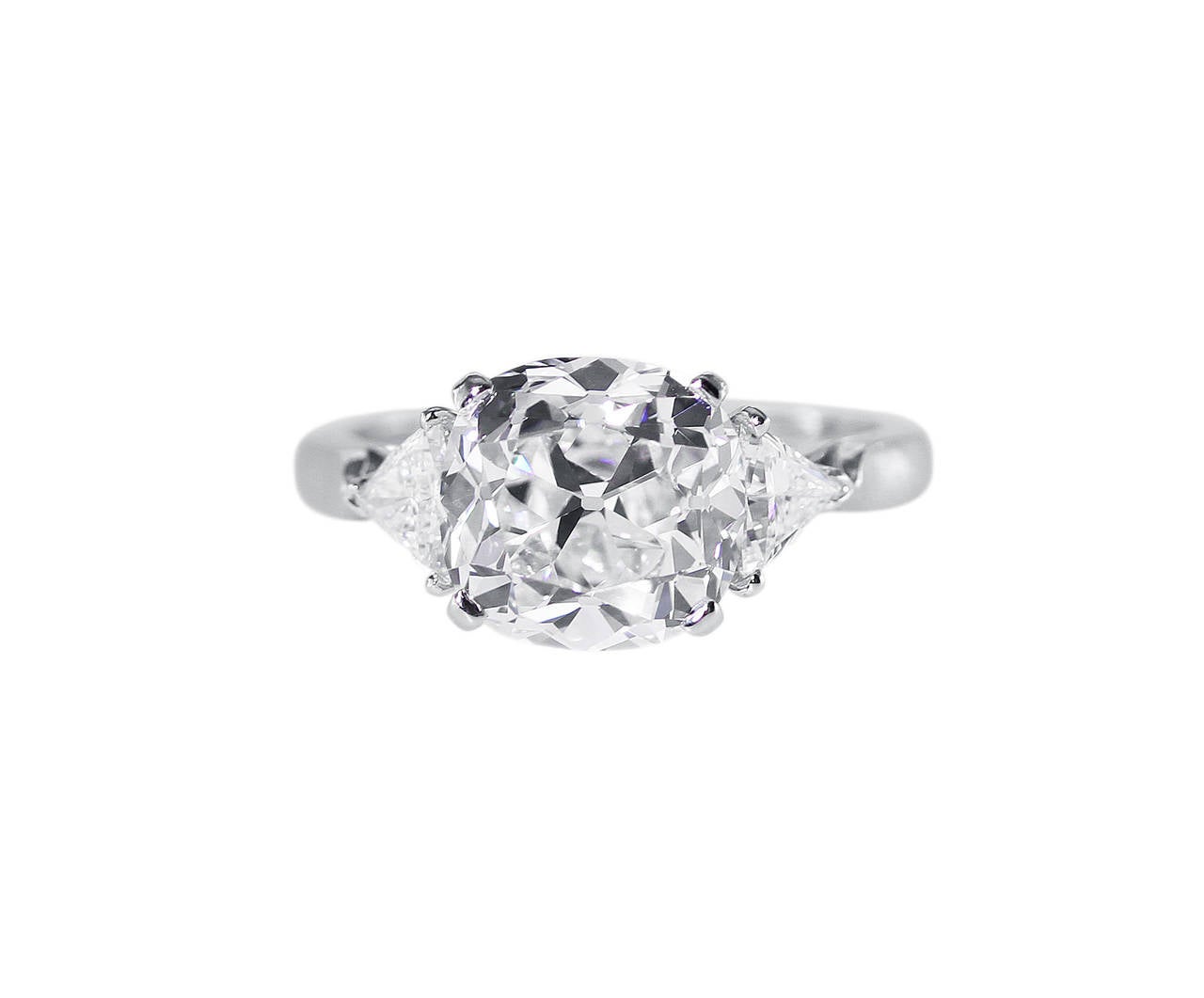 This stunning engagement ring is of superior quality and craftsmanship, all original, and made by the firm Van Cleef & Arpels.  Using only the best stones and materials, this ring features an old mine cut diamond weighing 4.02 carats which is of E